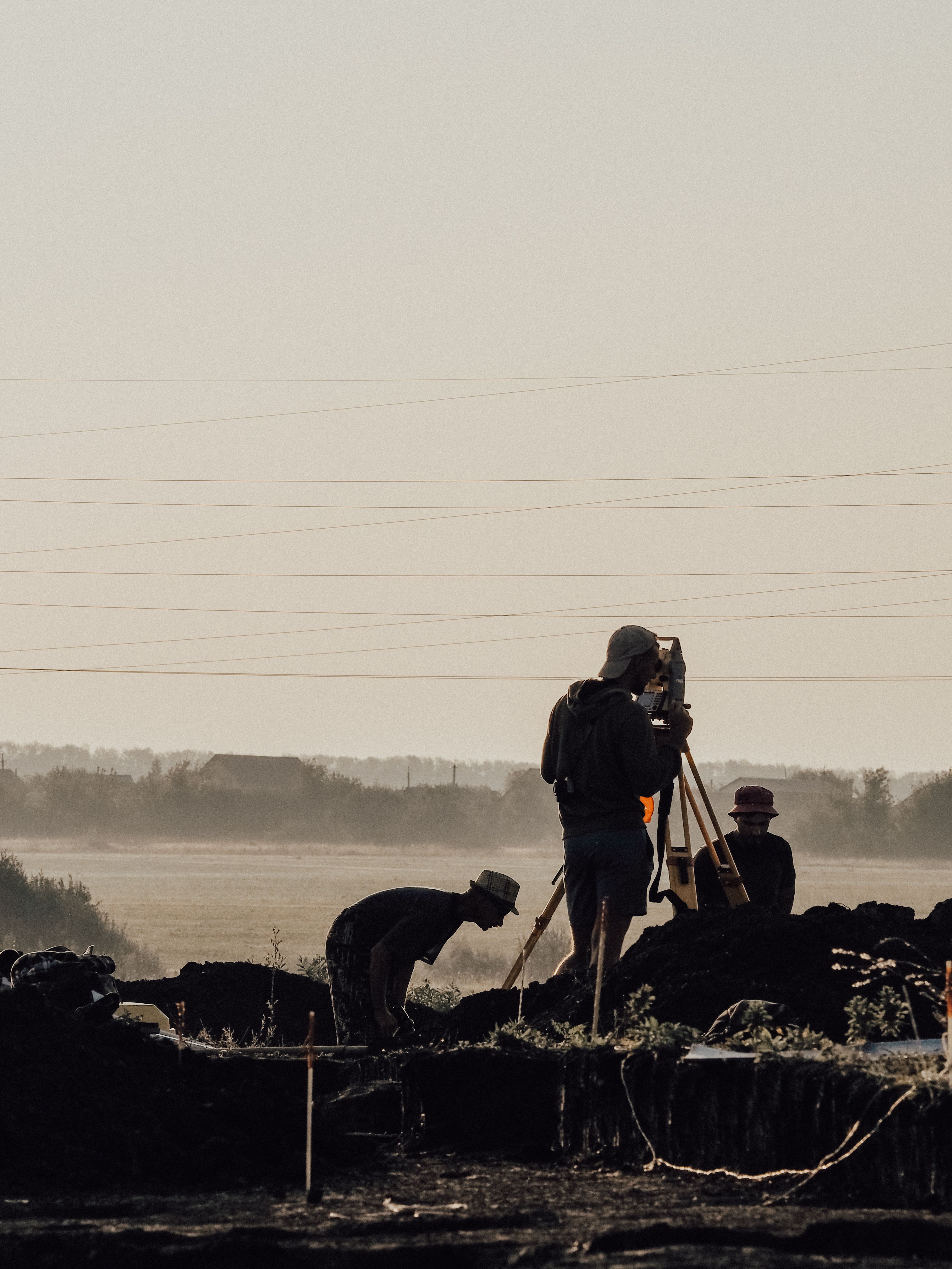 Survey crew setting out a site at first light